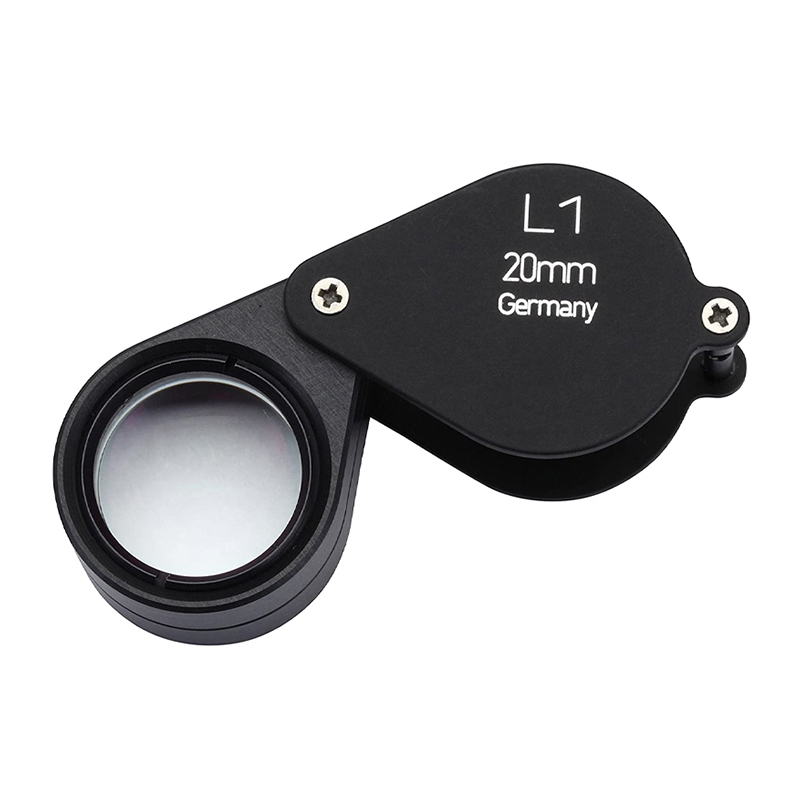 Black hinged Loupe, L1 20mm, Germany, closed view showing the lens. Triplet Loupe Schneider L1. Black hinged Loupe, L1 20mm, Germany, closed view showing the lens. Triplet Loupe Schneider L1.