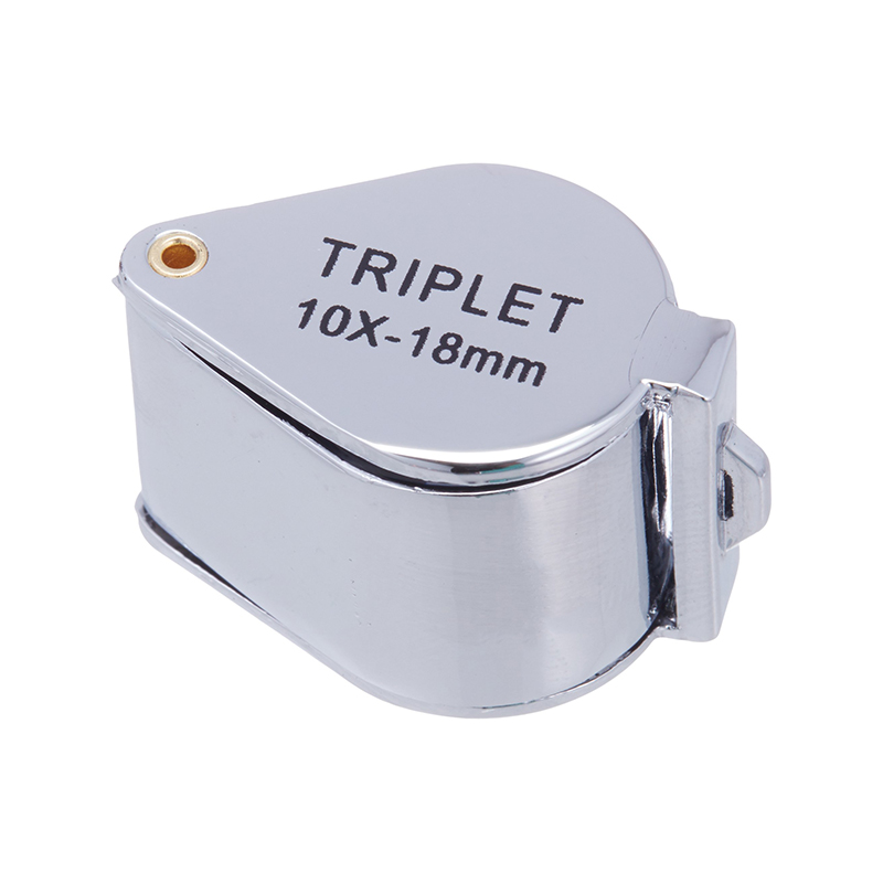 The JYBS diamond triplet loupe fully closed inside its protective metal housing, highlighting the built-in lanyard eyelet. The JYBS diamond triplet loupe fully closed inside its protective metal housing, highlighting the built-in lanyard eyelet.
