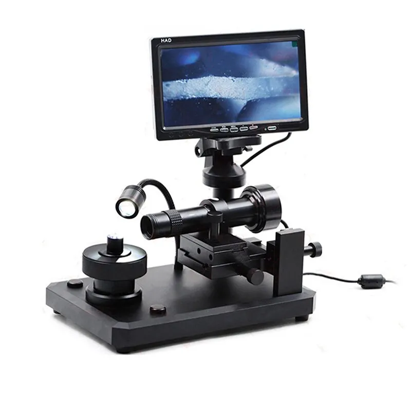 The 7-inch monitor of the JYBS digital diamond loupe demonstrating a high-contrast macro view of a girdle surface texture. The 7-inch monitor of the JYBS digital diamond loupe demonstrating a high-contrast macro view of a girdle surface texture.