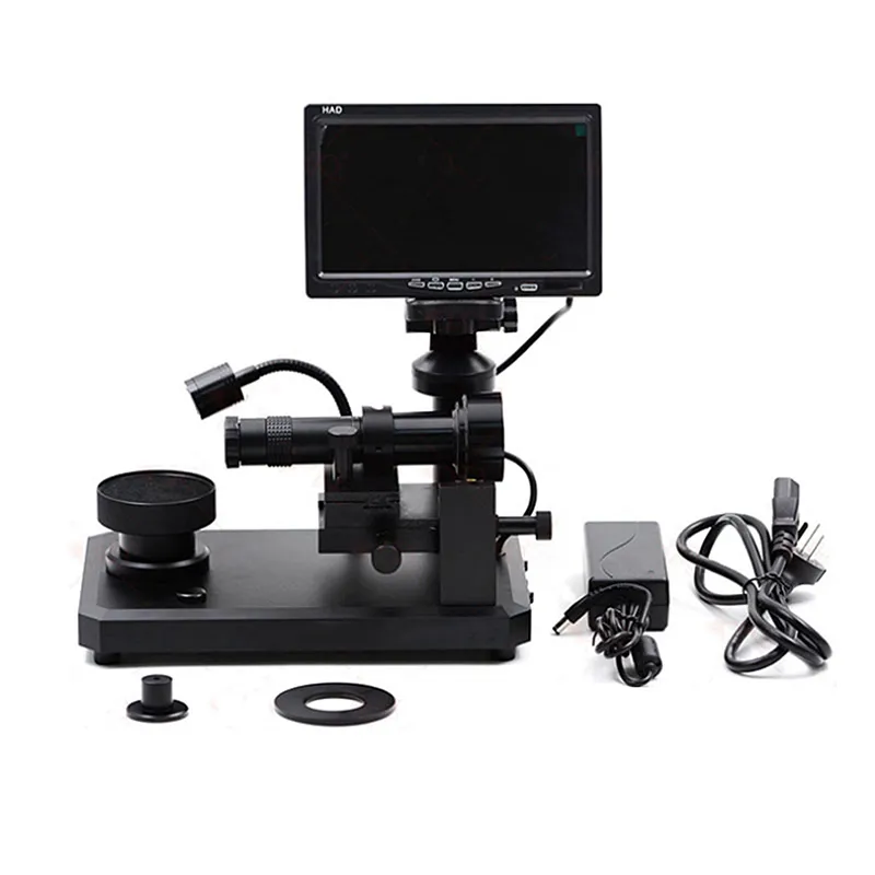 Frontal profile layout of the JYBS digital diamond inscription viewer displayed beside its loose stage rings and power adapter. Frontal profile layout of the JYBS digital diamond inscription viewer displayed beside its loose stage rings and power adapter.