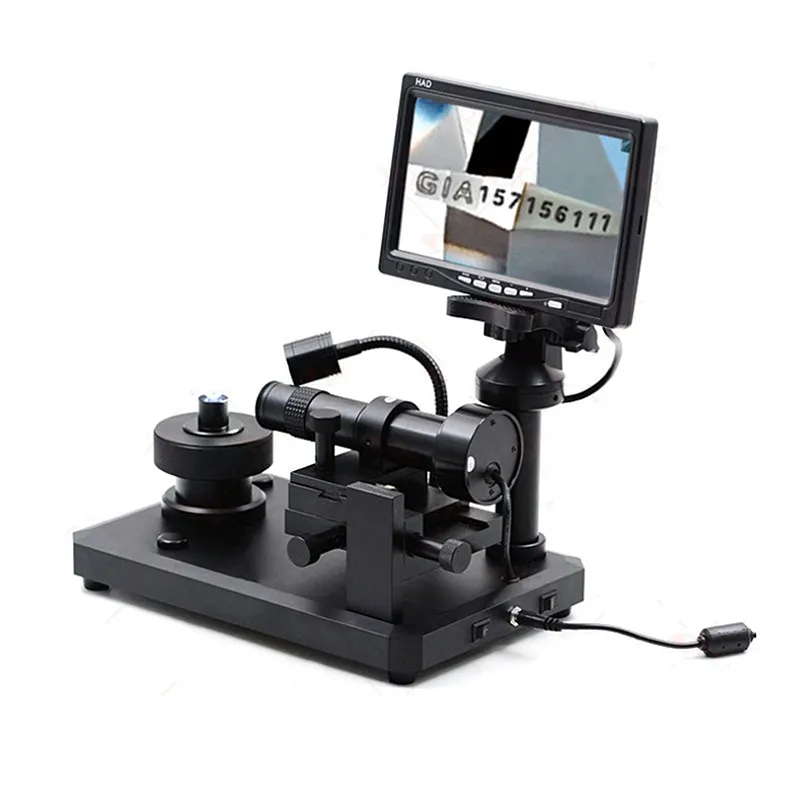 Right oblique view of the JYBS digital diamond inscription viewer showing the power line connection and base controls. Right oblique view of the JYBS digital diamond inscription viewer showing the power line connection and base controls.