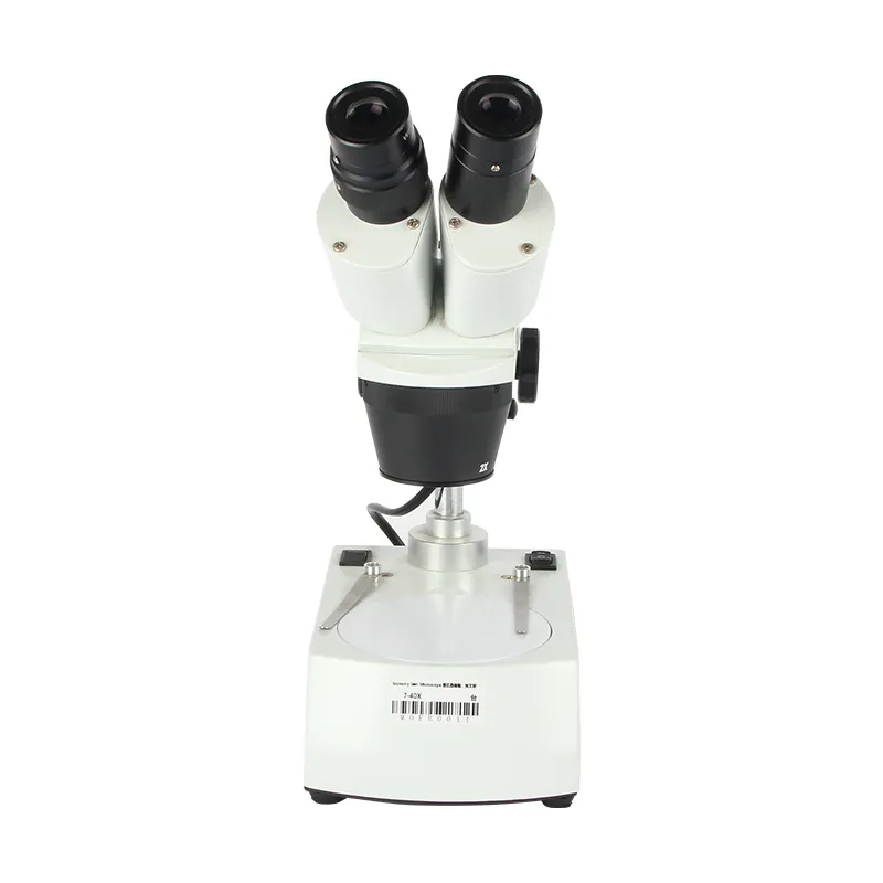 Frontal layout view of the JYBS gem microscope showing the circular stage plate and spring-loaded specimen clips. Frontal layout view of the JYBS gem microscope showing the circular stage plate and spring-loaded specimen clips.