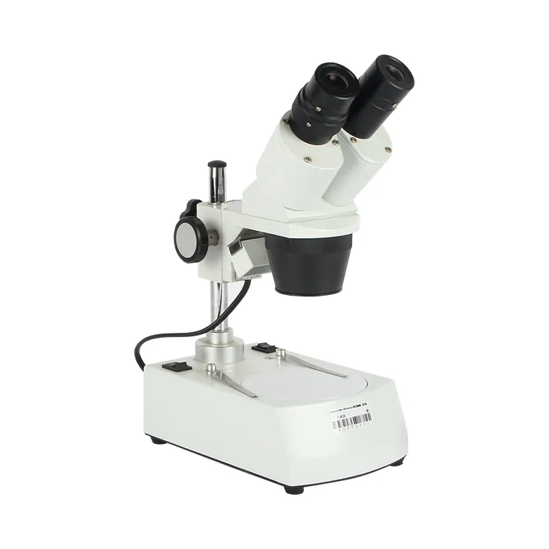 Front right oblique view of the off-white JYBS economy gem microscope featuring an inclined binocular stereo head. Front right oblique view of the off-white JYBS economy gem microscope featuring an inclined binocular stereo head.