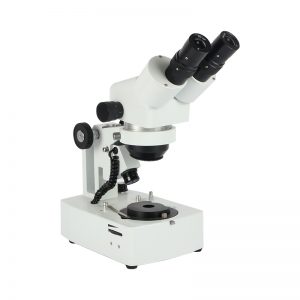 Front right oblique view of the white JYBS gem microscope highlighting its dual halogen lighting tracks and inclined stereo zoom head.