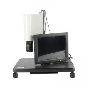 Front view of the white JYBS integrated video microscope highlighting the 10-inch LCD display mounted on a spacious black base stage.