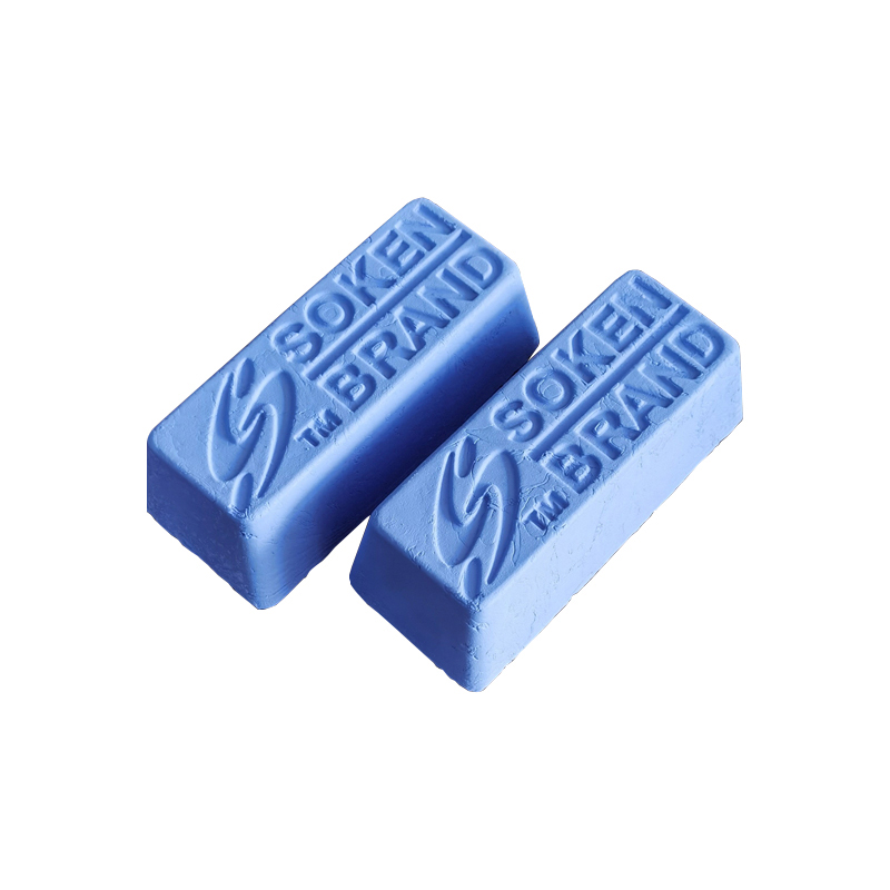 An overhead view of two Soken Brand blue polishing compound bars on a white background. An overhead view of two Soken Brand blue polishing compound bars on a white background.