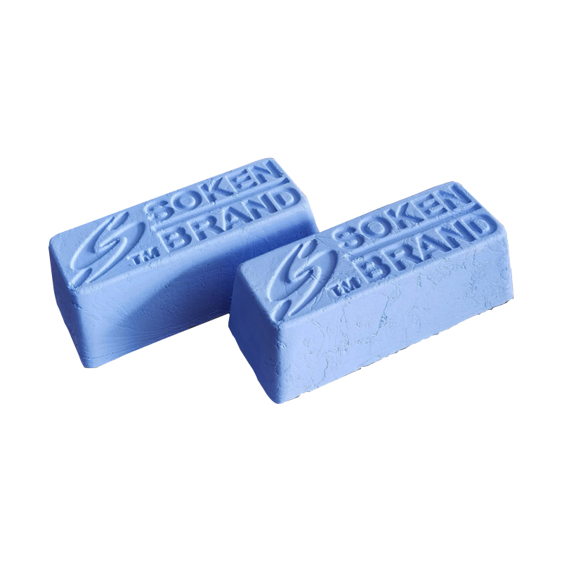 Two blue bars of Soken Brand polishing compound, placed side-by-side on a white background. Two blue bars of Soken Brand polishing compound, placed side-by-side on a white background.