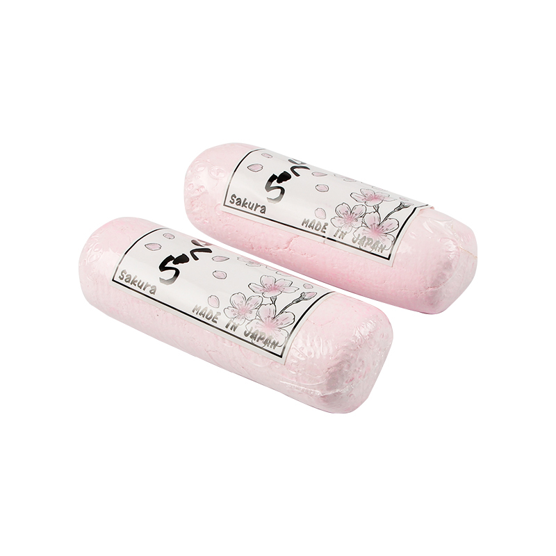 alfa mirage® sakura polishing compound pt/gold/silver Two wrapped pink SAKURA Polishing Compounds angled with "Sakura MADE IN JAPAN" labels and cherry blossom art.