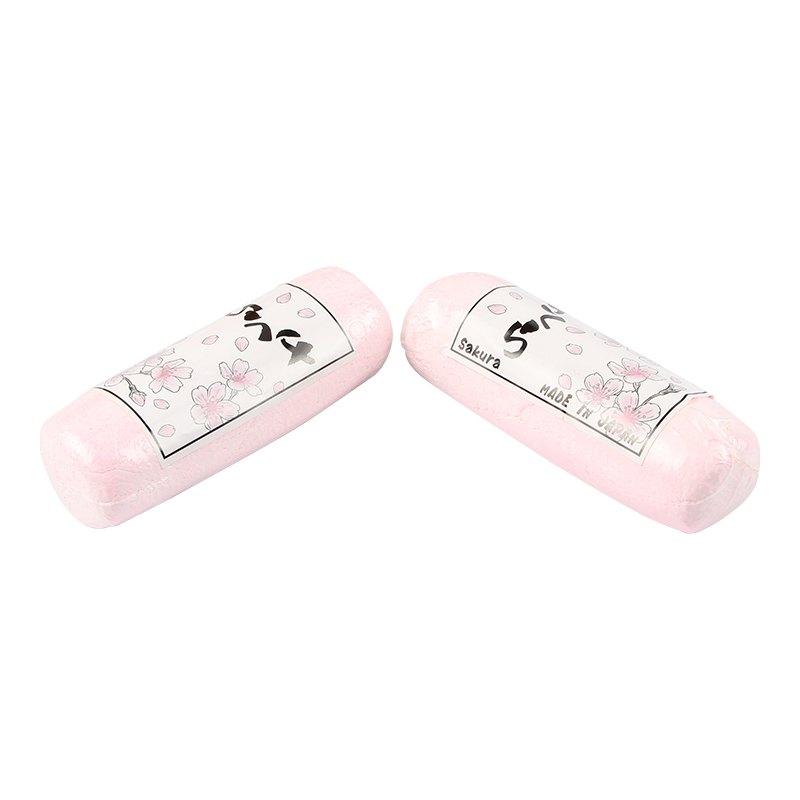 Two wrapped pink SAKURA Polishing Compounds, one slightly atop the other, showing "Sakura MADE IN JAPAN" labels. Two wrapped pink SAKURA Polishing Compounds, one slightly atop the other, showing "Sakura MADE IN JAPAN" labels.