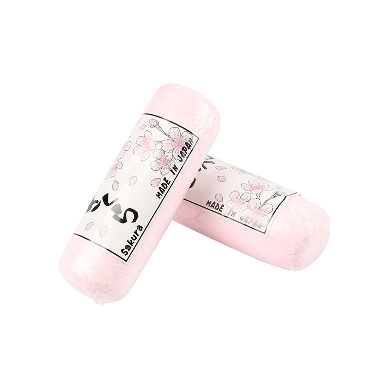 Two wrapped pink SAKURA Polishing Compounds, stacked vertically with "Sakura MADE IN JAPAN" labels. Two wrapped pink SAKURA Polishing Compounds, stacked vertically with "Sakura MADE IN JAPAN" labels.
