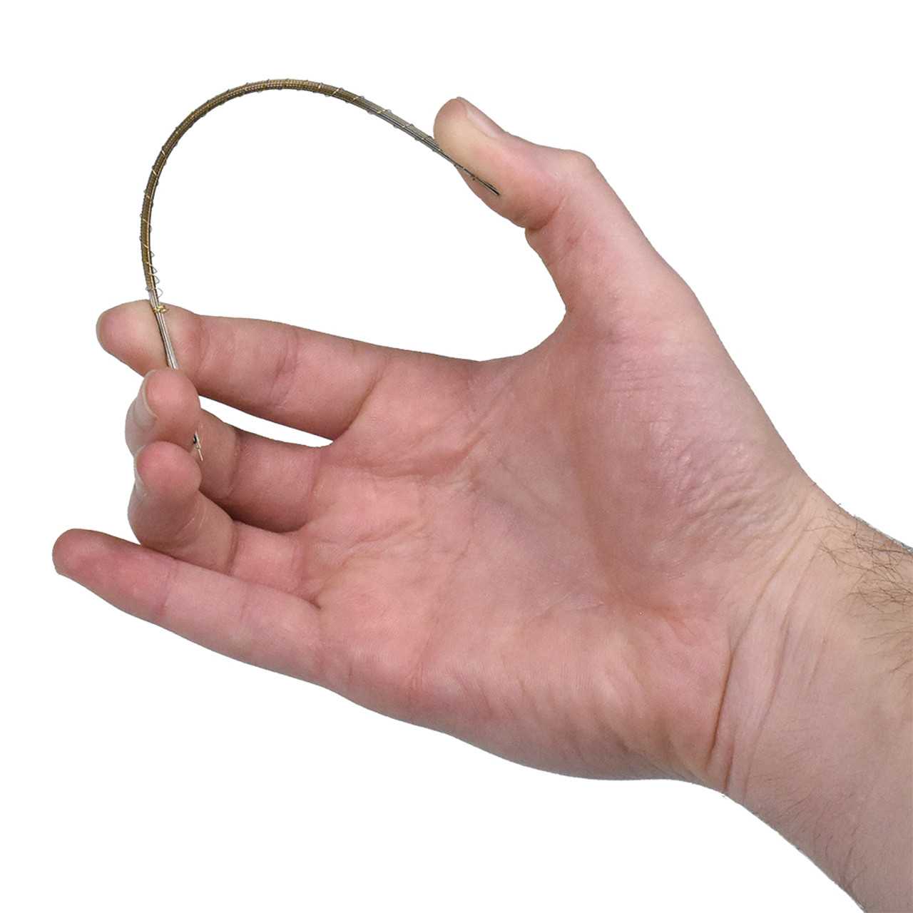 Hand holding a flexible, gold-colored jeweler's saw blade bent into a curve, demonstrating its durability. Hand holding a flexible, gold-colored jeweler's saw blade bent into a curve, demonstrating its durability.
