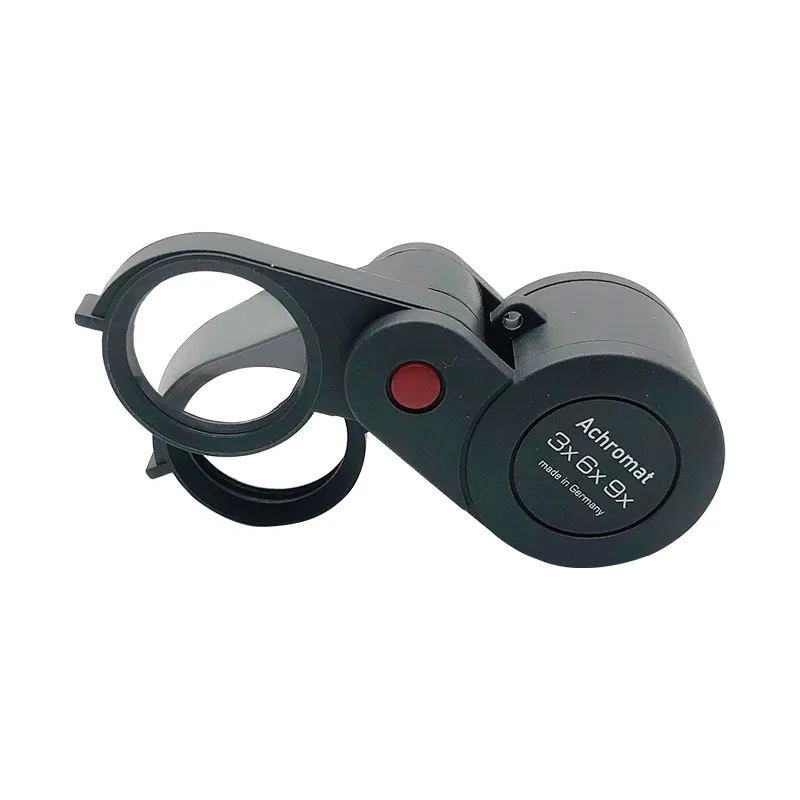 Front oblique layout of the Eschenbach dual-power folding magnifier showing the black matte glass-fiber housing structure. Front oblique layout of the Eschenbach dual-power folding magnifier showing the black matte glass-fiber housing structure.