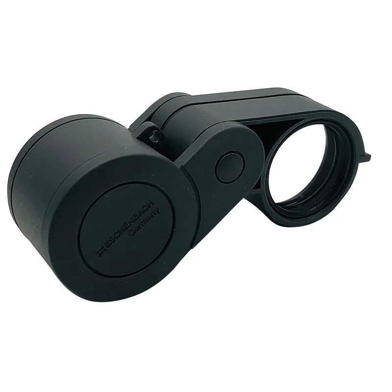 Direct view of the closed Eschenbach pocket loupe casing highlighting the official molded branding logo. Direct view of the closed Eschenbach pocket loupe casing highlighting the official molded branding logo.