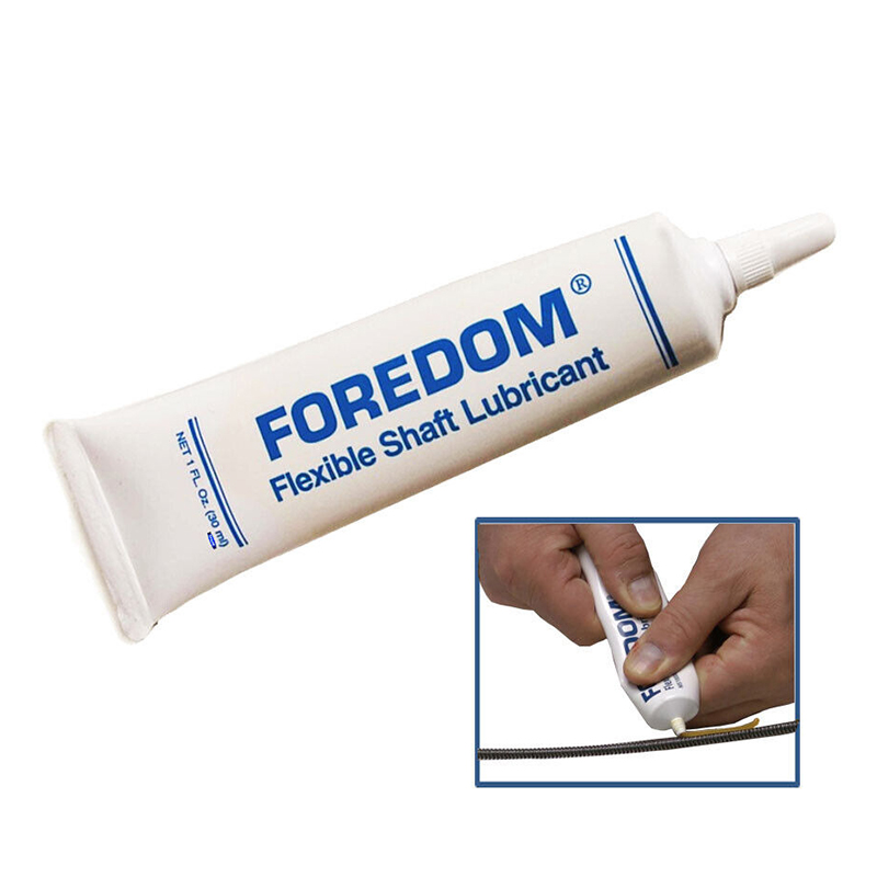 Foredom Flexible Shaft Lubricant tube with inset showing hands applying grease to a shaft. Foredom Flexible Shaft Lubricant tube with inset showing hands applying grease to a shaft.