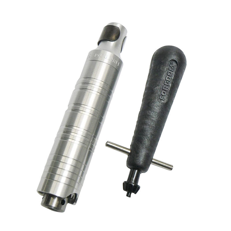 Foredom H 30 Chuck Handpiece and HPCK-0 chuck key in molded plastic handle isolated. Foredom H 30 Chuck Handpiece and HPCK-0 chuck key in molded plastic handle isolated.