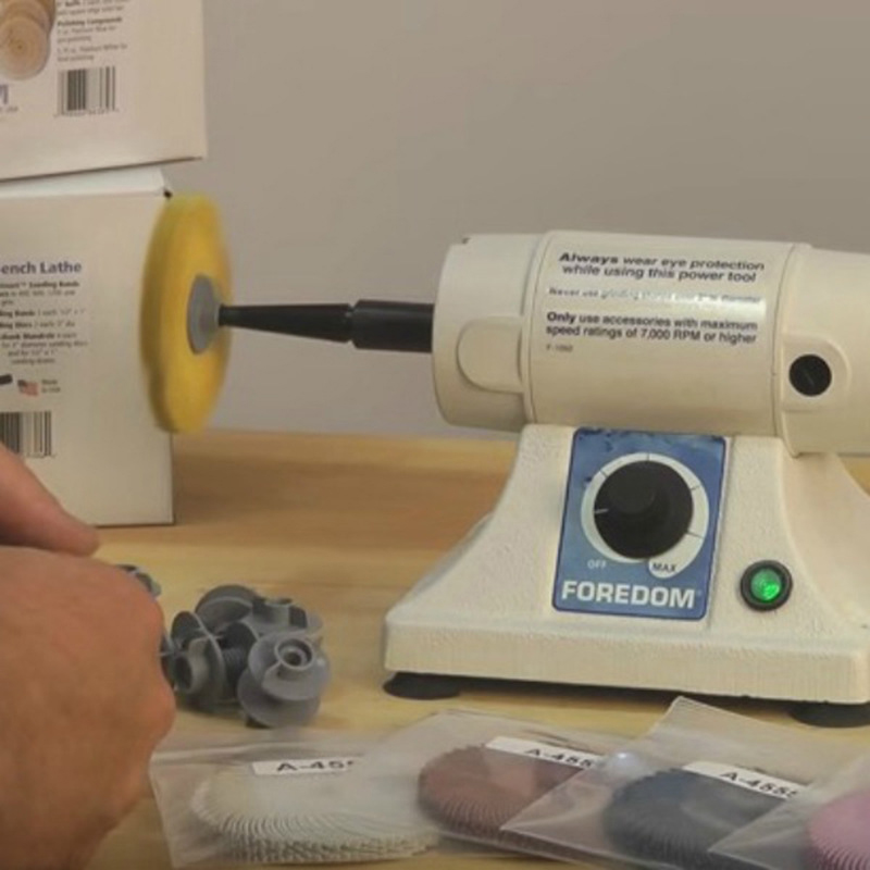 Foredom M BL 22 Bench Lathe in use polishing a small part with a buffing wheel and accessories. Foredom M BL 22 Bench Lathe in use polishing a small part with a buffing wheel and accessories.