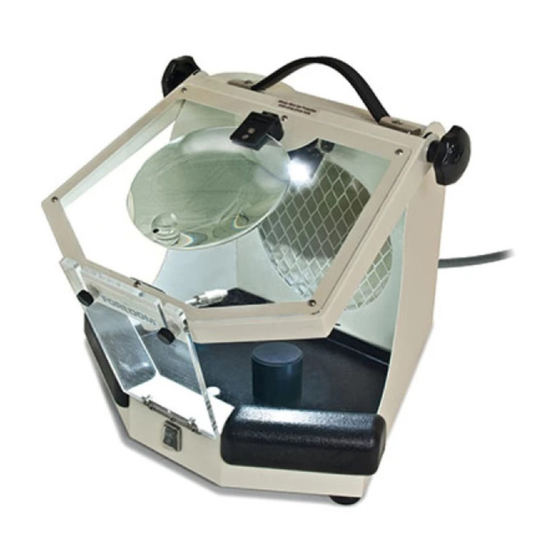 Foredom MALC15 LED Work Chamber with built-in light, magnifier, and hinged clear shield, viewed at an angle. Foredom MALC15 LED Work Chamber with built-in light, magnifier, and hinged clear shield, viewed at an angle.