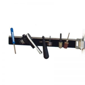 Foredom Magnetic Arm with non-scratch felt surface holding various accessories and small metal tools
