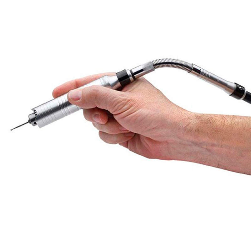 Hand holding a flexshaft handpiece connected to the Duplex Spring Adapter HP775; tool is in use. Hand holding a flexshaft handpiece connected to the Duplex Spring Adapter HP775; tool is in use.