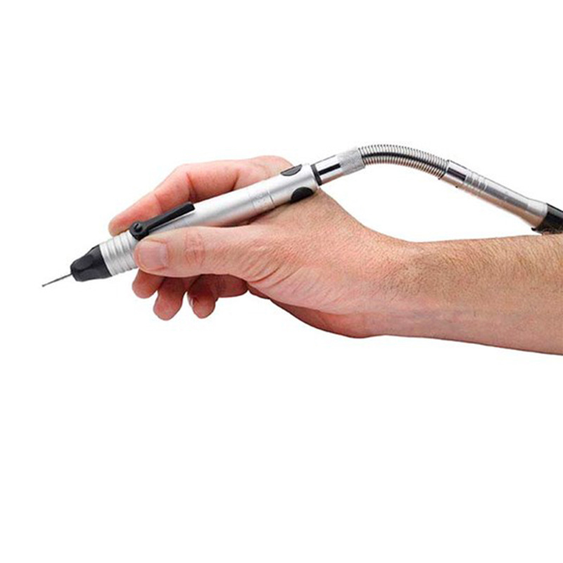 Hand using a Foredom Handpiece connected via the flexible HP775 Duplex Adapter with a small burr tool. Hand using a Foredom Handpiece connected via the flexible HP775 Duplex Adapter with a small burr tool.