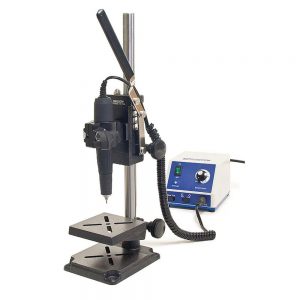 Foredom P-DP70 Drill Press Stand with a micromotor handpiece and speed control box, assembled for precision drilling.