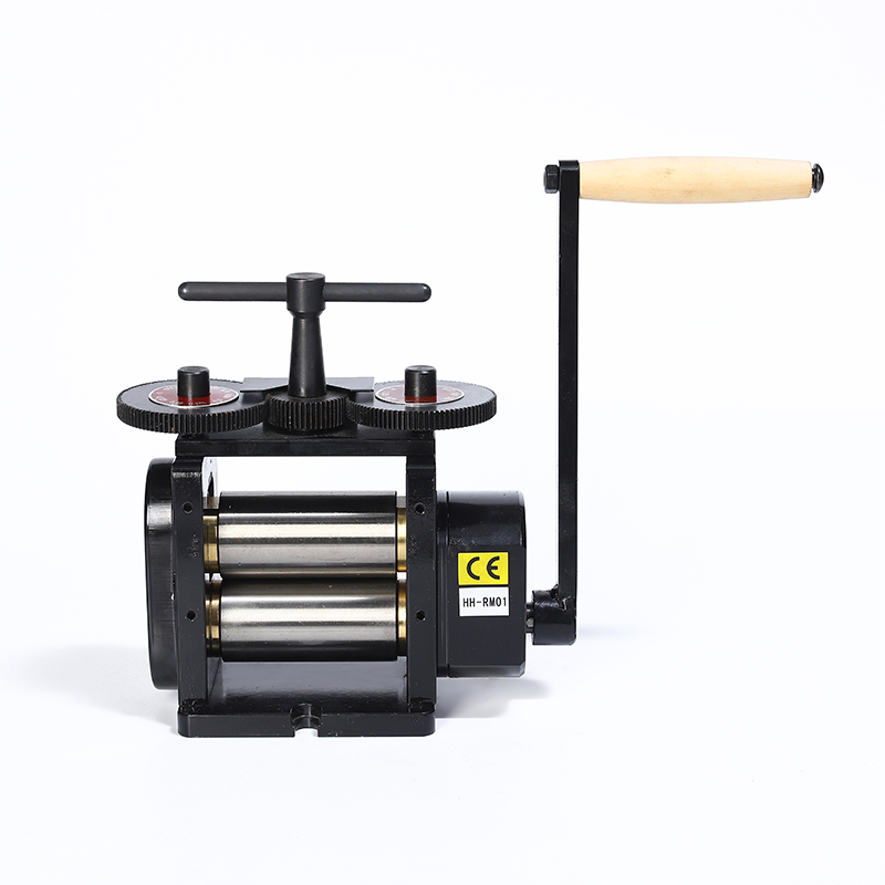 Black manual flat rolling mill with smooth rollers and a wooden hand crank.