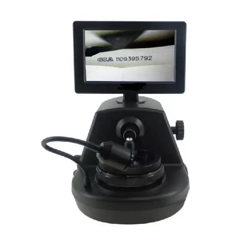 Video microscope system displaying a GIA laser inscription, "GIA 1109395792", magnified on its monitor.