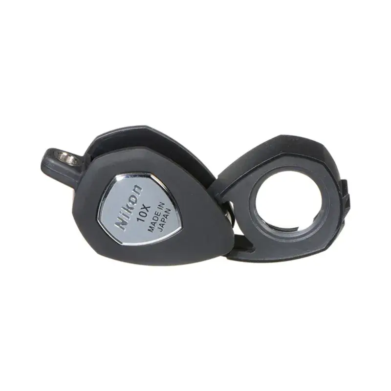 Nikon 10x magnification triplet loupe with a black folding frame, made in Japan for professional jewelry inspection.