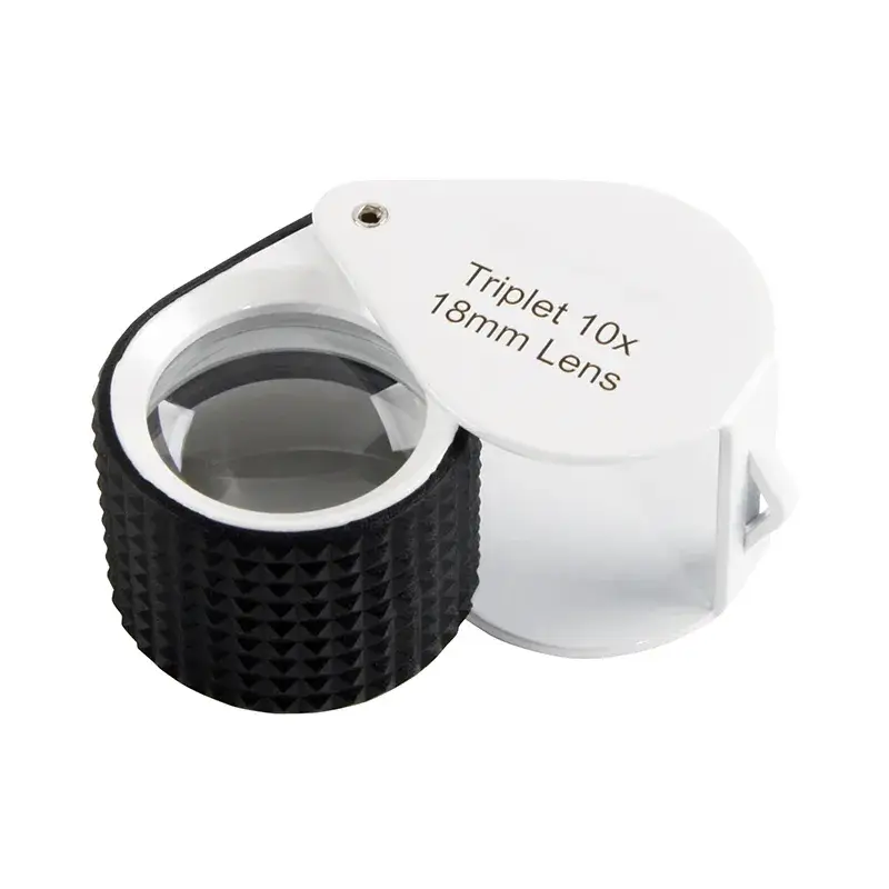 A teardrop-shaped folding triplet 10X-18mm lens loupe with a knurled black rubber grip and white casing.