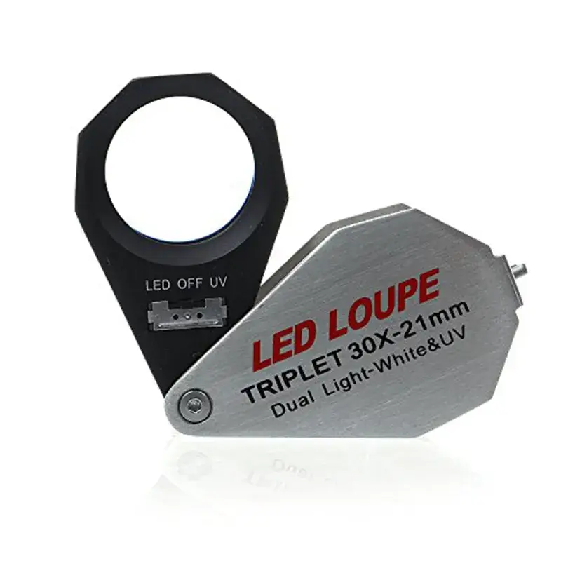 A 30x-21mm folding triplet loupe featuring dual light modes with an LED, OFF, and UV toggle switch.