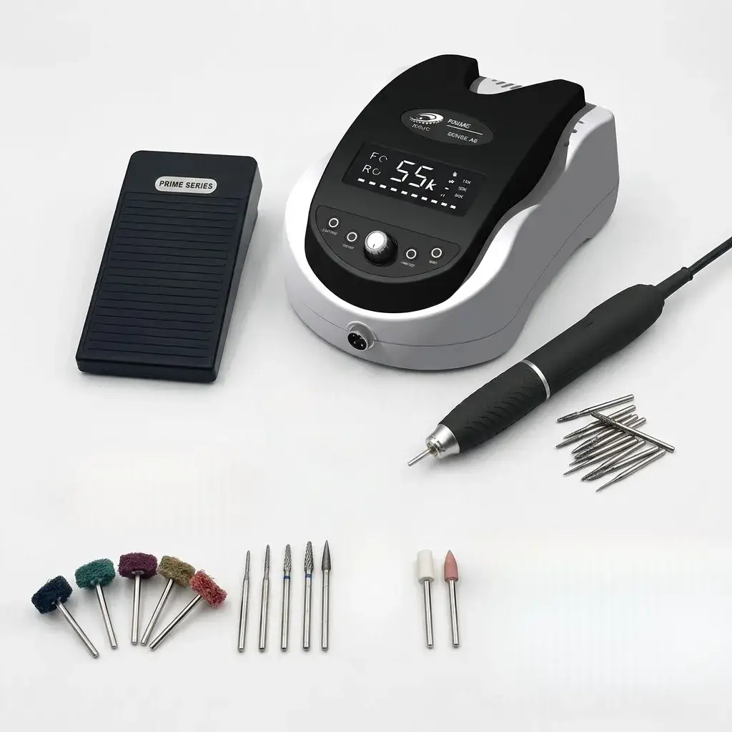 A professional desktop micromotor control box with a foot pedal, handpiece, and assorted carving and polishing burs.