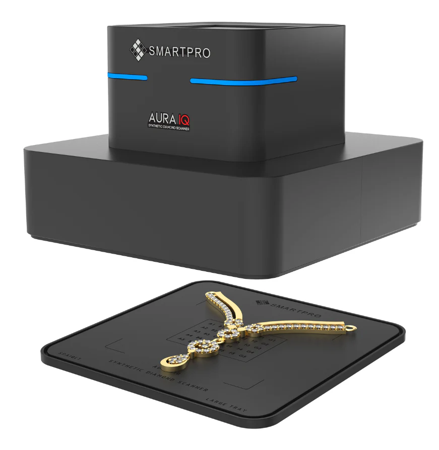 The SmartPro Aura IQ scanner positioned next to its large tray holding a gold diamond necklace for jewelry mode scanning. The SmartPro Aura IQ scanner positioned next to its large tray holding a gold diamond necklace for jewelry mode scanning.