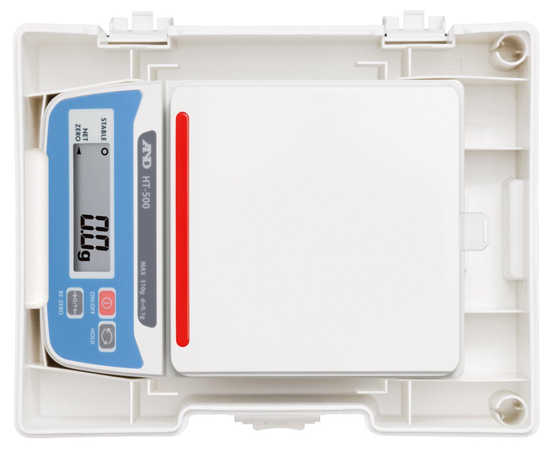 a&d and electronic scale ht 300 Overhead perspective showing the white A&D precision balance nestled securely inside the bottom half of its stackable white storage shell.