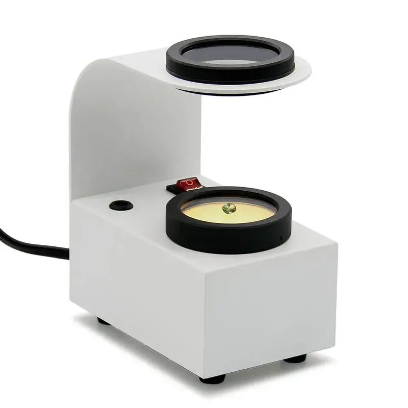 A white desktop gem polariscope with light source for optic character testing.