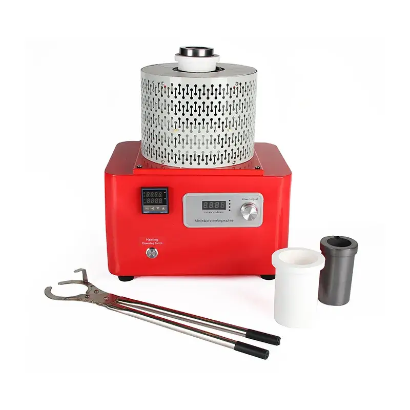 A red electric melting furnace with metal pouring tongs, a white ceramic crucible, and a graphite crucible.