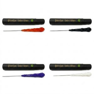 Four Greenlion Solder Wand titanium picks with black packaging tubes in amber gold, black, purple, and white handles.