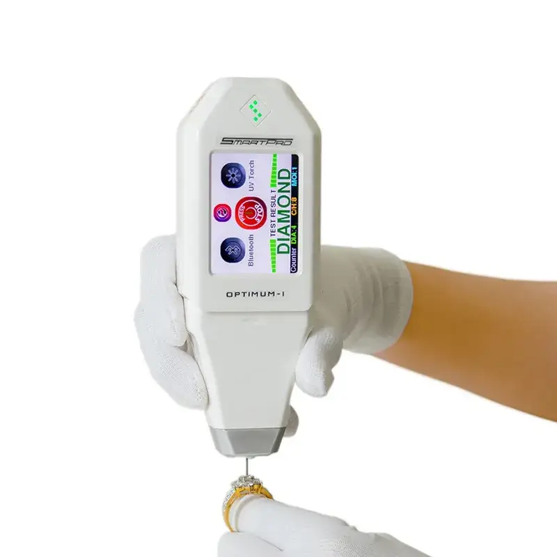 A handheld SmartPro Optimum-I electronic tester checking a diamond ring.