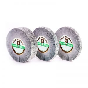 Trio arrangement of KAAN ZIMPARA Plus 100mm diamond emery flap wheels displaying side thickness variations and branded center hubs.