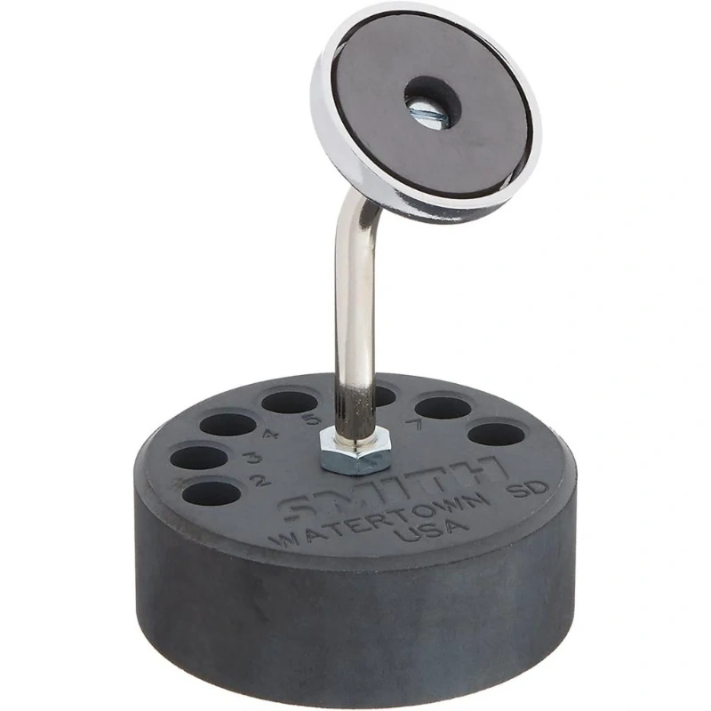 miller® smith magnetic torch stand and tip organizer Front perspective view of the Miller Smith magnetic torch stand showing the angled disc magnet and weighted seven-hole base.