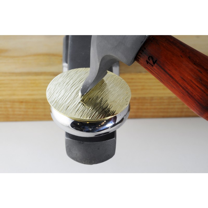 fretz® sharp texturing / raising hammer In-use bench demonstration showing the Fretz HMR-12 hammer creating crisp parallel hammered line textures on a brass disc over a polished doming stake.