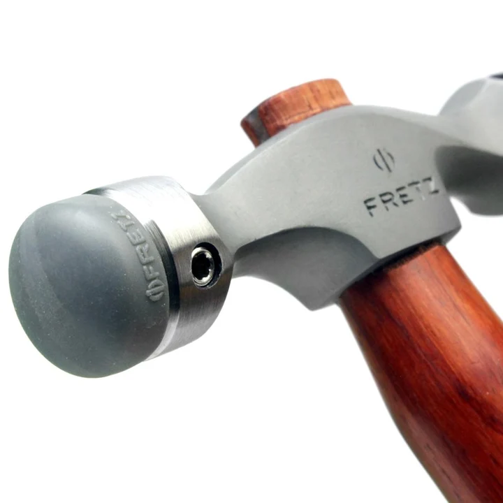 fretz® double ended insert hammer Close-up of the Fretz HMR-7 stainless steel head fitted with a smooth bullet-nose domed plastic insert.