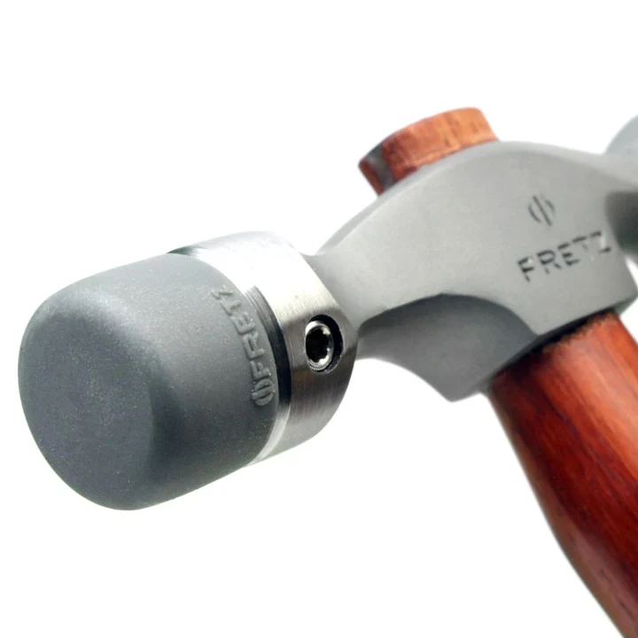 fretz® double ended insert hammer Detailed macro view of the Fretz HMR-7 collar fitted with a cylindrical flat-faced plastic insert featuring molded Fretz branding and side set-screw retention.