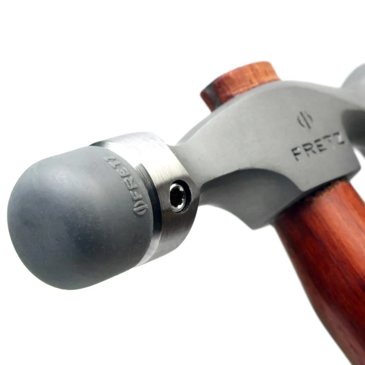 fretz® double ended insert hammer Close-up perspective of the Fretz HMR-7 stainless steel head fitted with a broad hemispherical domed plastic embossing insert.