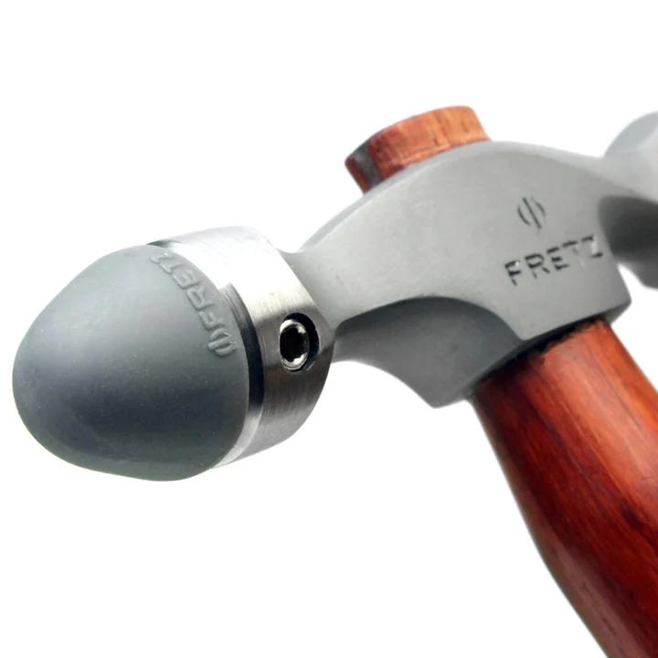 fretz® double ended insert hammer Detailed macro perspective of the HMR-7 head showing a tapered conical plastic embossing insert installed in the collar socket.
