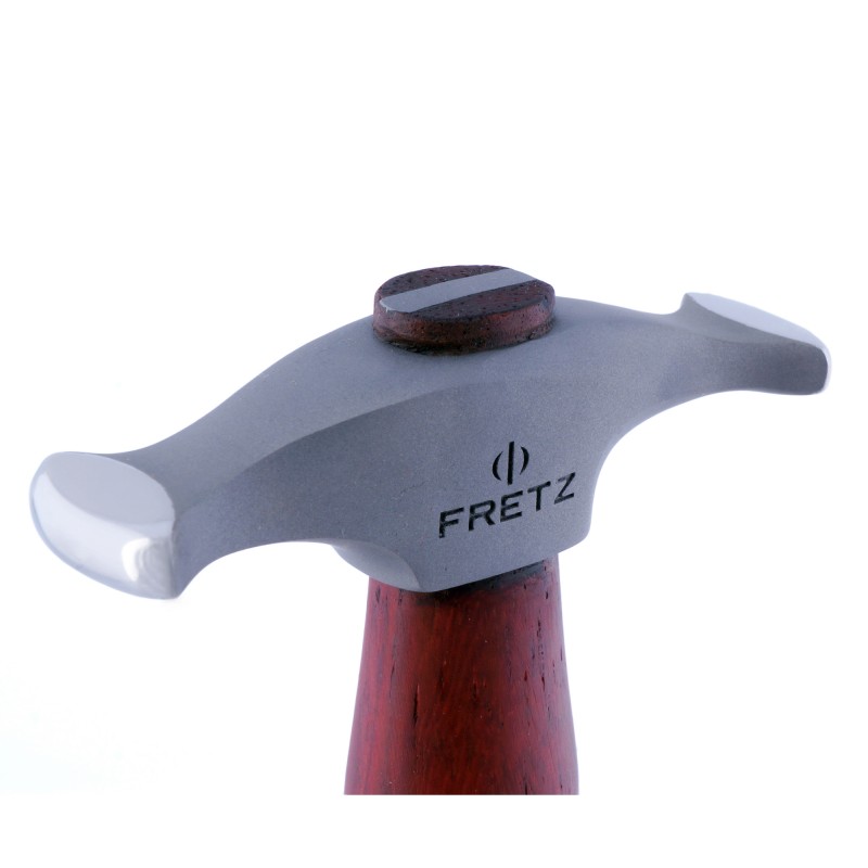 fretz® rounded narrow raising hammer Close-up side profile of the Fretz HMR-8 rounded narrow raising hammer head showing the engraved Fretz logo and polished curved rectangular face.