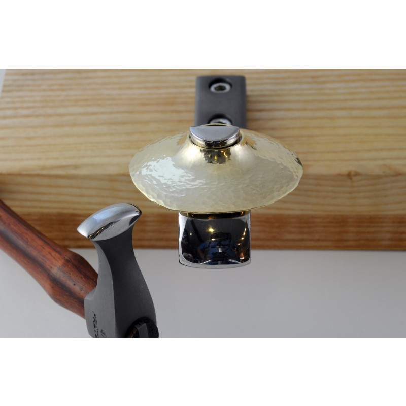 fretz® rounded wide raising hammer In-use bench view of the Fretz HMR-9 hammer shaping a domed brass component supported on a steel silversmithing stake.