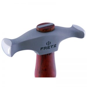 Close-up side profile of the Fretz HMR-9 rounded wide raising hammer head showing the engraved Fretz logo and polished wide convex face.