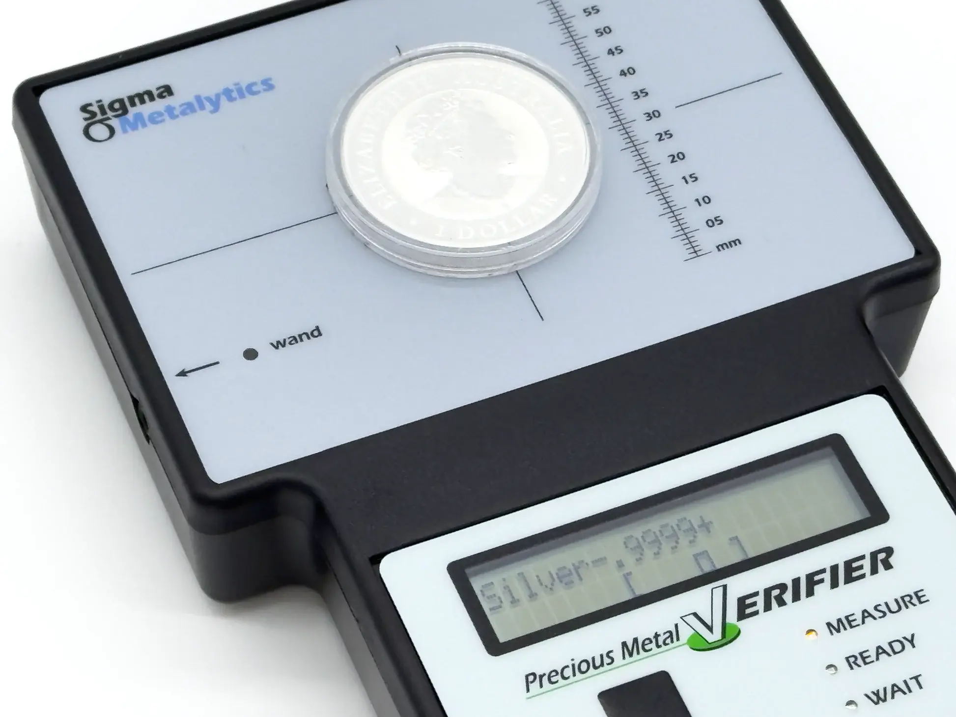 sigma metalytics precious metal verifier pmv original Perspective view of an Australian silver dollar inside a protective plastic capsule being authenticated on the PMV sensor bed.