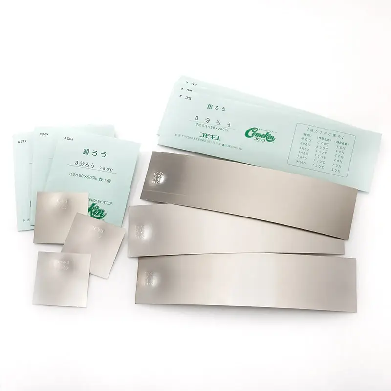 An assortment of silver solder forms including wire solder, sheet solder, and solder paste.