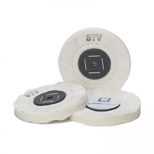 Set of compact 100mm LUXOR by MÉRARD STV cotton buffing discs showing the stapled cardboard center, single concentric stitch, and 54-ply fabric face.